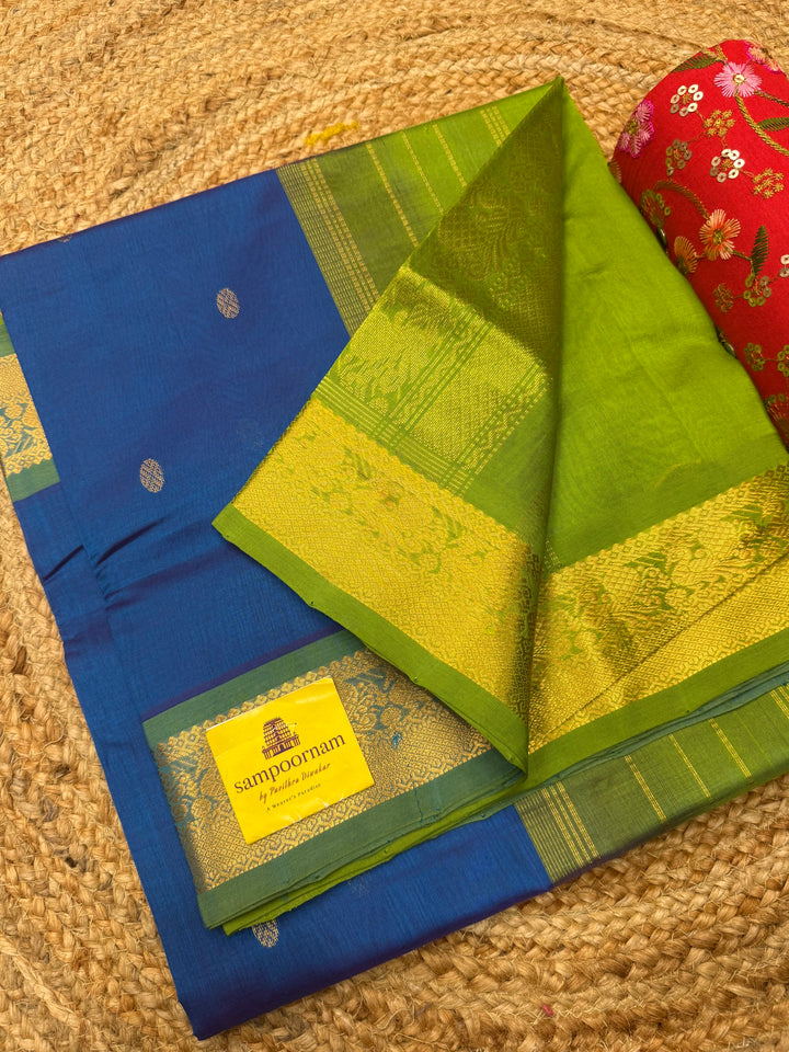 Coppersulfate Blue with Green , rich Zari butta in the body , Traditional Big Borders and rich Pallu  Silk Cotton Saree