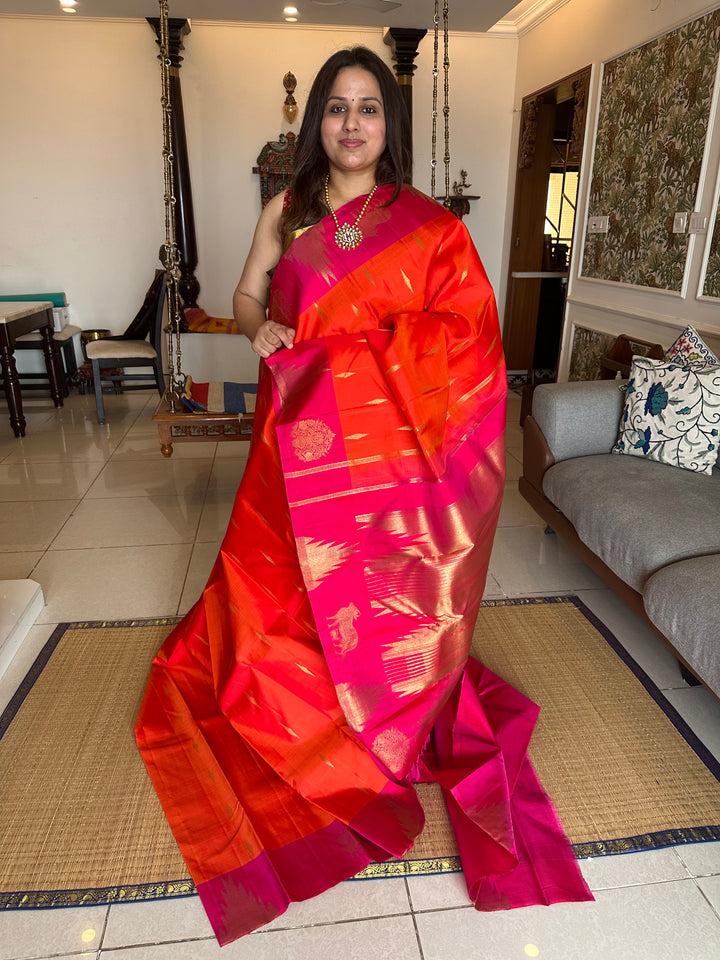 A Beautiful Orange with Dark pink with Traditional Temple, Gomatha and Kodi Zari Motif in Border and Rich pallu , Pure Kanjivaram Silk Saree