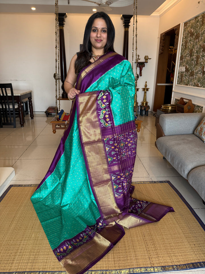 Turquoise Blue with Purple , checks in the body , design the blouse , traditional Kanchi borders and rich Pallu Pochampally Ikkat Silk Saree