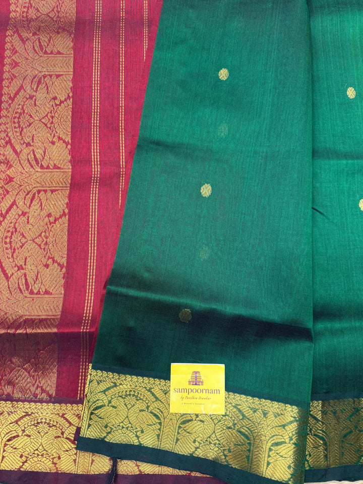 Green with Maroon  , rich Zari butta in the body , Traditional Big Borders and rich Pallu  Silk Cotton Saree
