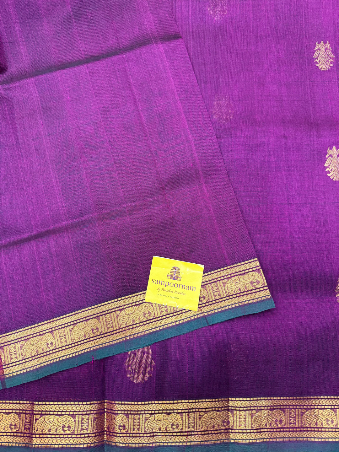 Wine with Green Selvedge , rich two side Peacock Zari butta in the body , Traditional borders rich Pallu Silk Cotton Saree