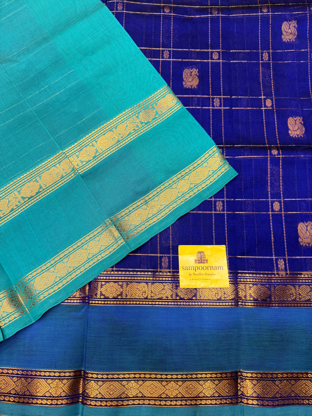 Royal Blue with Turquoise Blue  , Zari Checks with Chakram and Mayil butta in the body , Traditional borders and  rich Pallu Silk Cotton Saree