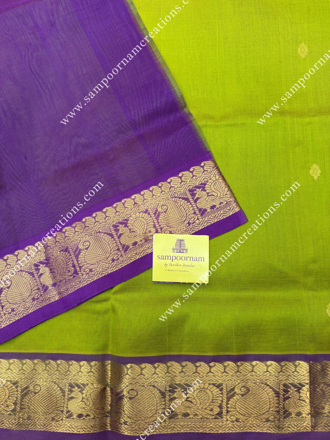 Lemon Yellow with Dark Magenta  , Rich Zari Butta in the body , traditional borders and rich Pallu Silk Cotton Saree