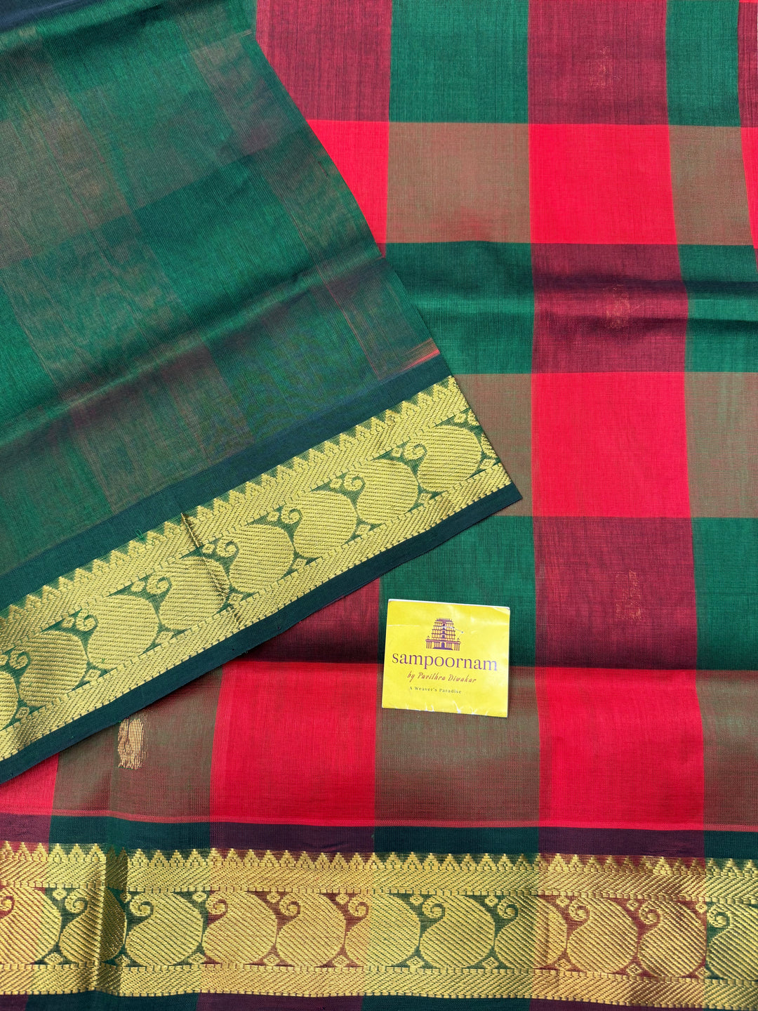 Red , Green , Maroon  with Green , Pallum Pazham checks with rich Mayil butta , traditional borders and  rich Pallu  Silk Cotton Saree