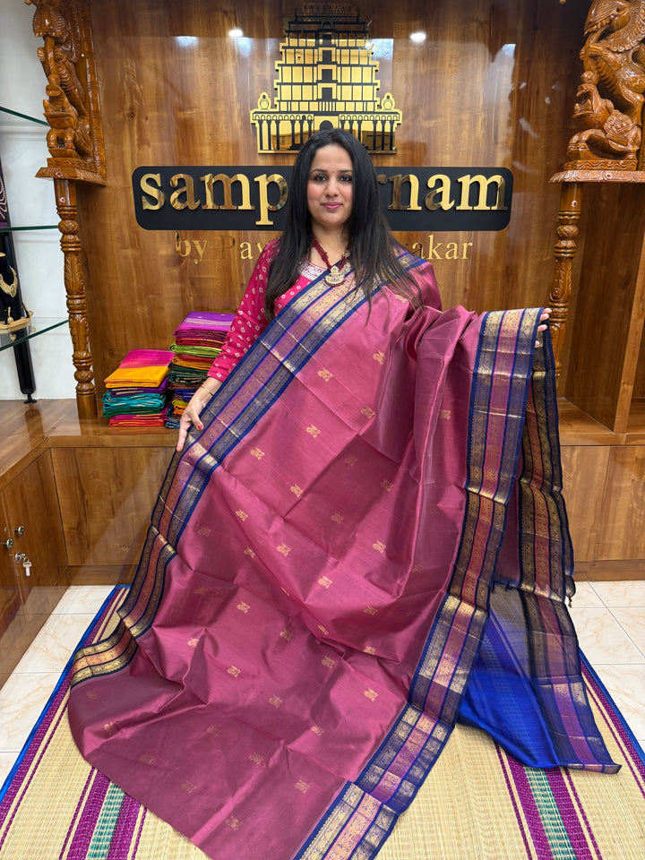 Mauve with Blue , rich Zari Mango  butta in the body , Traditional Kanchi borders and  rich Pallu Silk Cotton Saree