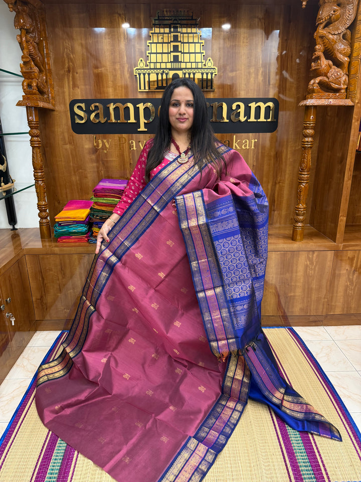Mauve with Blue , rich Zari Mango  butta in the body , Traditional Kanchi borders and  rich Pallu Silk Cotton Saree