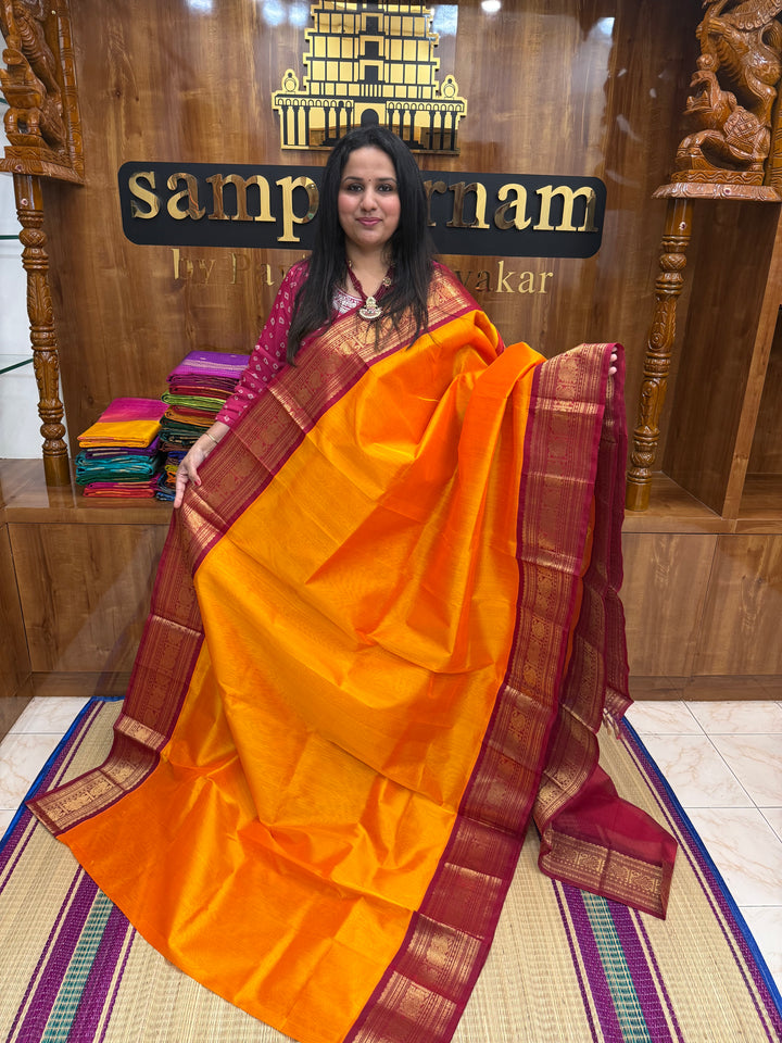 Mambazha Manjal with Kumkum Red  , Traditional Big Kanchi Borders and rich Pallu Korvai Silk Cotton Saree