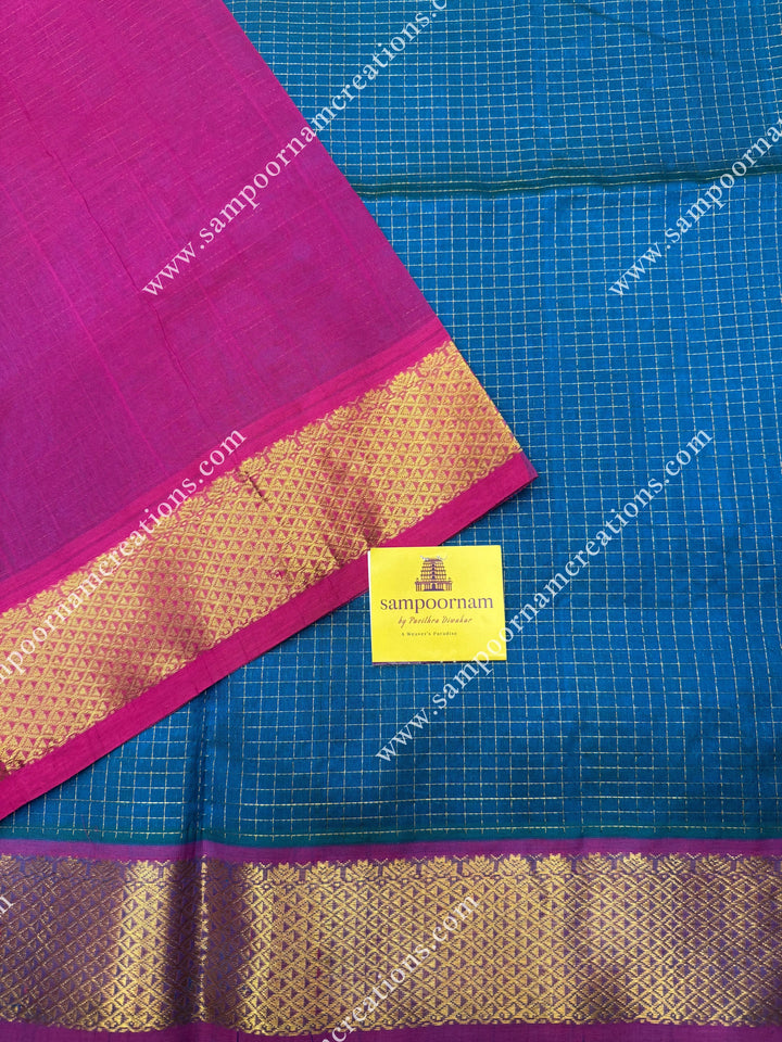 Turquoise Blue with Magenta , Rich Zari Checks in the body , traditional borders and rich Pallu Silk Cotton Sarees