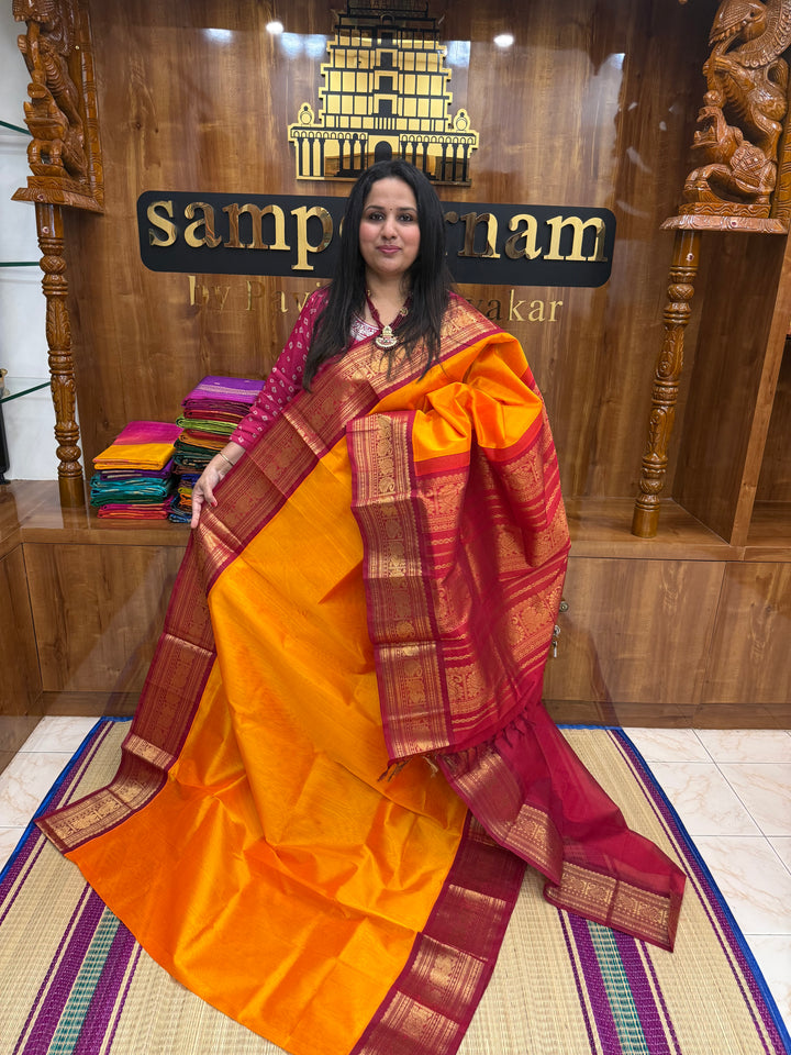 Mambazha Manjal with Kumkum Red  , Traditional Big Kanchi Borders and rich Pallu Korvai Silk Cotton Saree