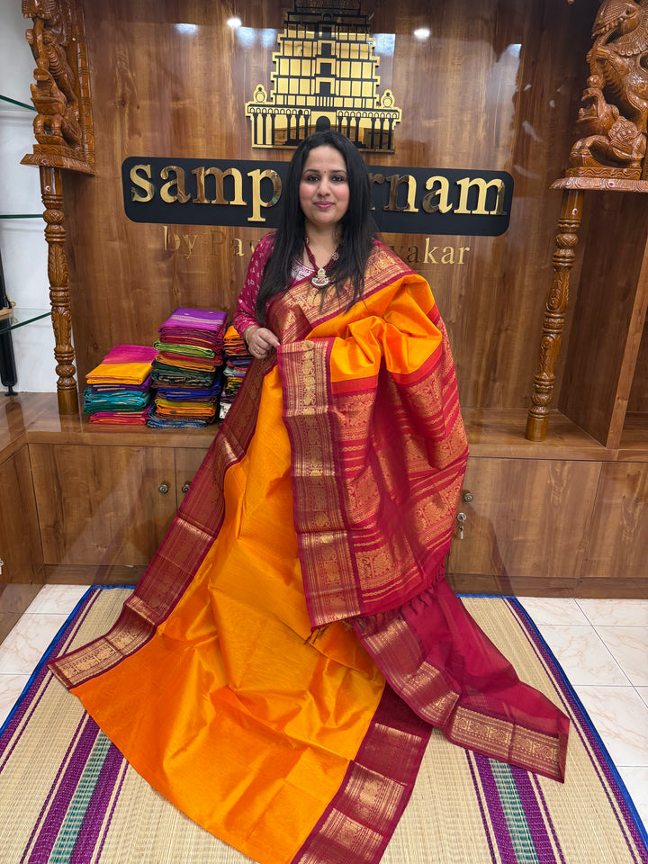 Mambazha Manjal with Kumkum Red  , Traditional Big Kanchi Borders and rich Pallu Korvai Silk Cotton Saree
