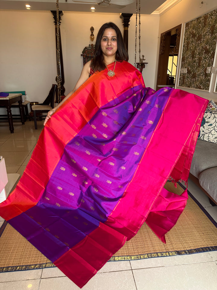 A Classic Mubbagam in Purple Orange and Magenta Shade with the Gandaberundu Zari motif in the Body and Rich Kili Motif in the Pallu Pure Kanjivaram Silk Saree