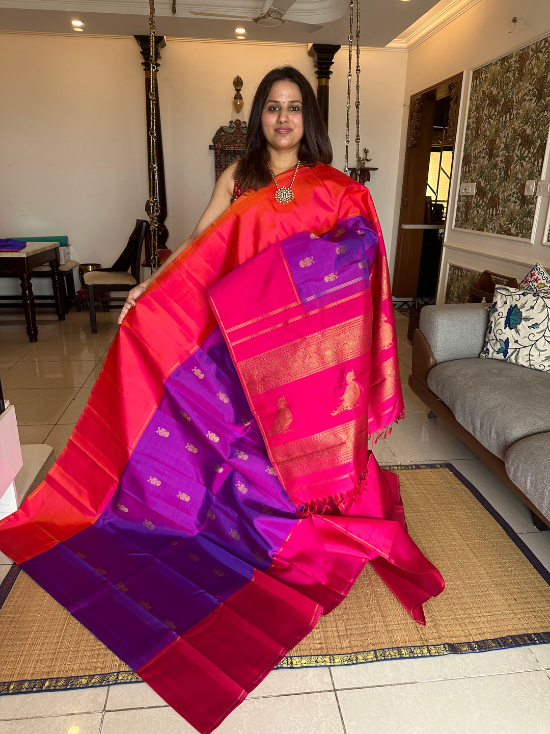 A Classic Mubbagam in Purple Orange and Magenta Shade with the Gandaberundu Zari motif in the Body and Rich Kili Motif in the Pallu Pure Kanjivaram Silk Saree