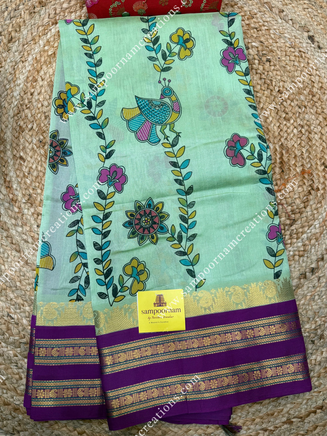Pastel Green  with Megenta, Floral Madhubani  Prints all over the body , rettapet borders with temple design and rich Pallu Korvai Silk Cotton Saree