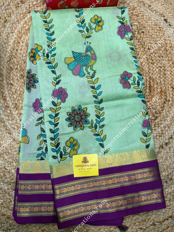 Pastel Green  with Megenta, Floral Madhubani  Prints all over the body , rettapet borders with temple design and rich Pallu Korvai Silk Cotton Saree