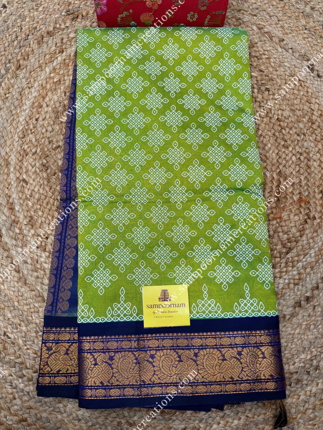 Parrot Green with Dark Blue , Kolam Prints all over the body , traditional borders and rich Pallu Korvai Silk Cotton Saree