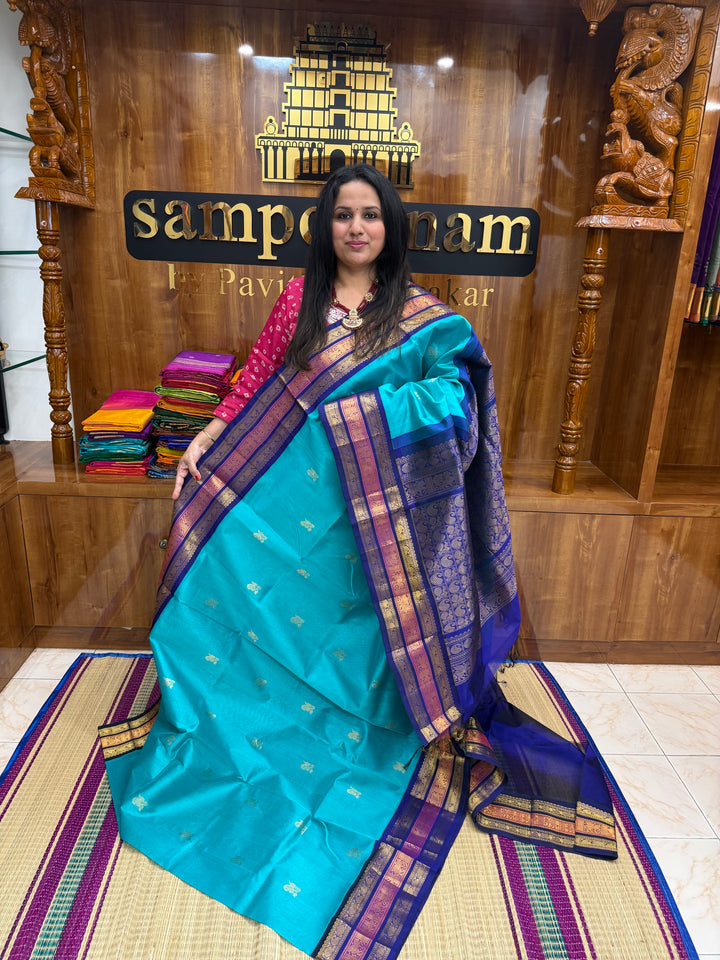 Ramar Blue  with Dark Blue , rich Mango Zari Butta in the body , traditional Kanchi borders and rich Pallu Korvai Silk Cotton Saree
