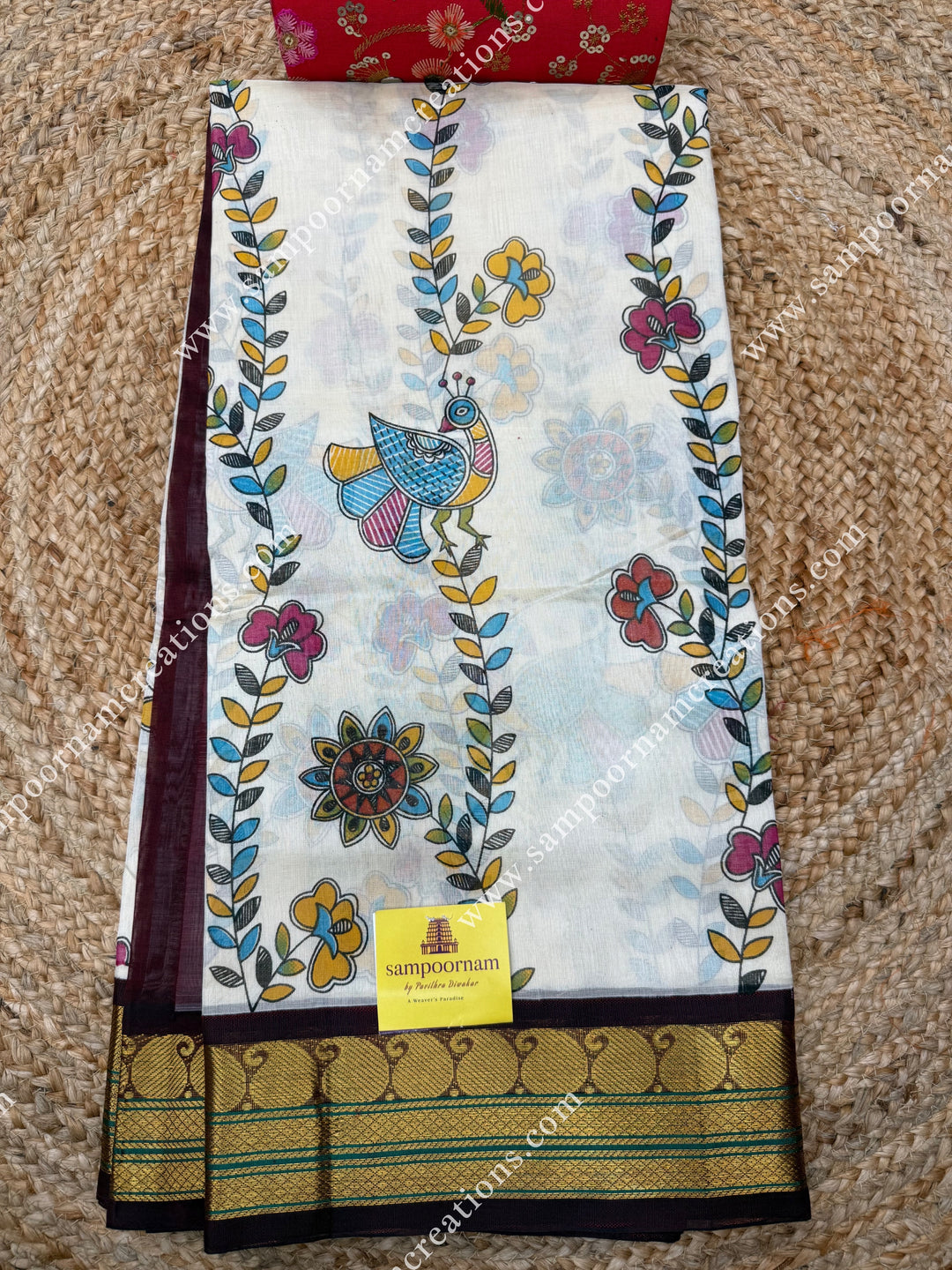 Off White with Wine, Floral Madhubani  Prints all over the body , traditional borders and rich Pallu Korvai Silk Cotton Saree