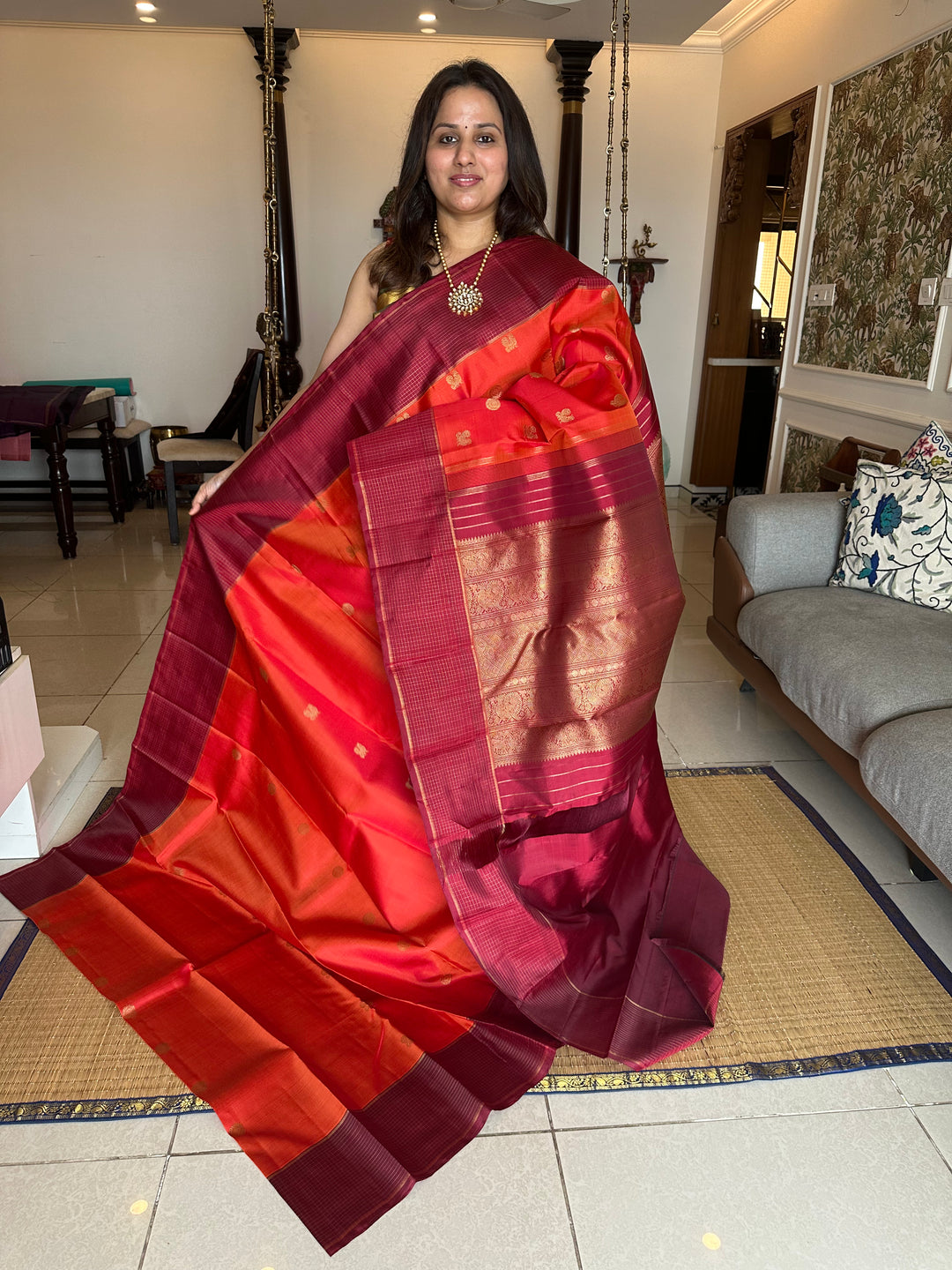 A Traditional Dark orange with Araku , Zari Checks Border , Mayil Chakram Zari Butta in Body and Traditional Rich Pallu Pure Kanjivaram Silk Saree