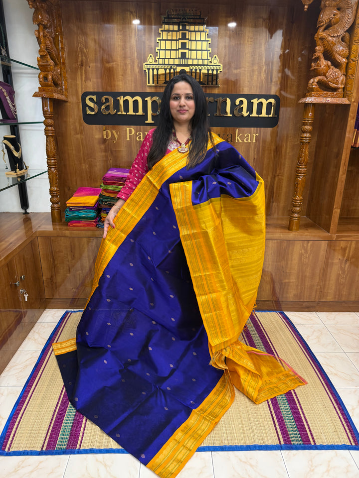 Royal Blue with Manjal , rich  Zari Butta in the body , Rettapet borders and rich Pallu Korvai Silk Cotton Saree