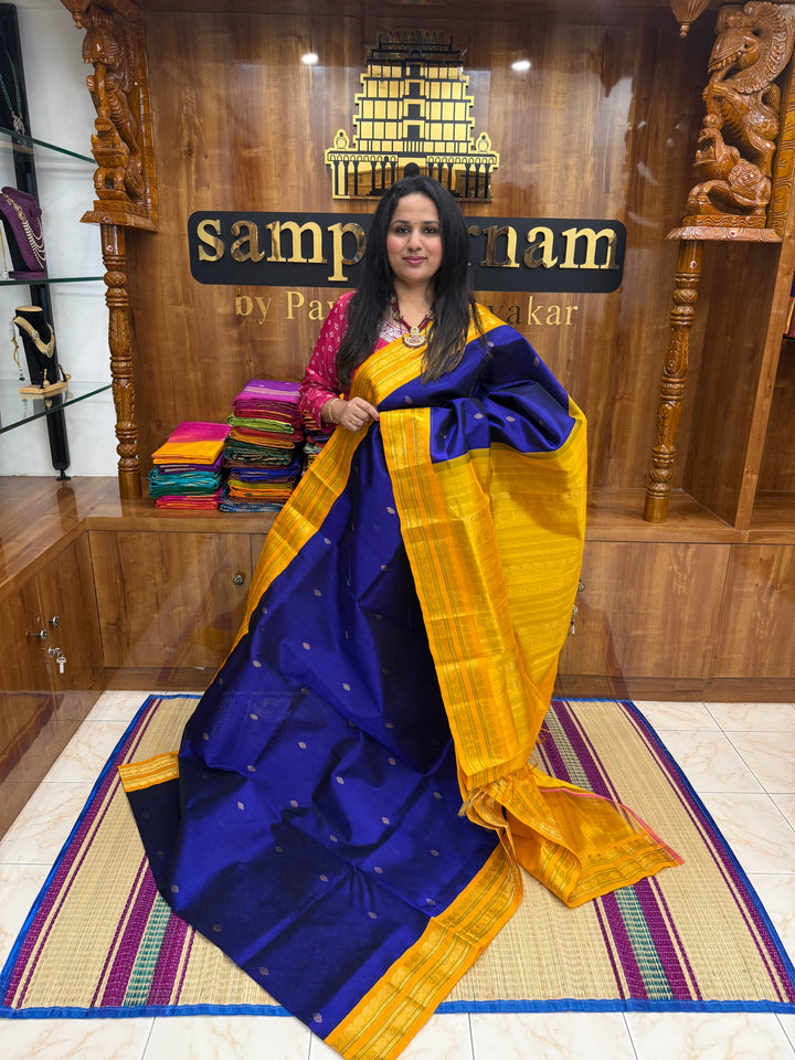 Royal Blue with Manjal , rich  Zari Butta in the body , Rettapet borders and rich Pallu Korvai Silk Cotton Saree