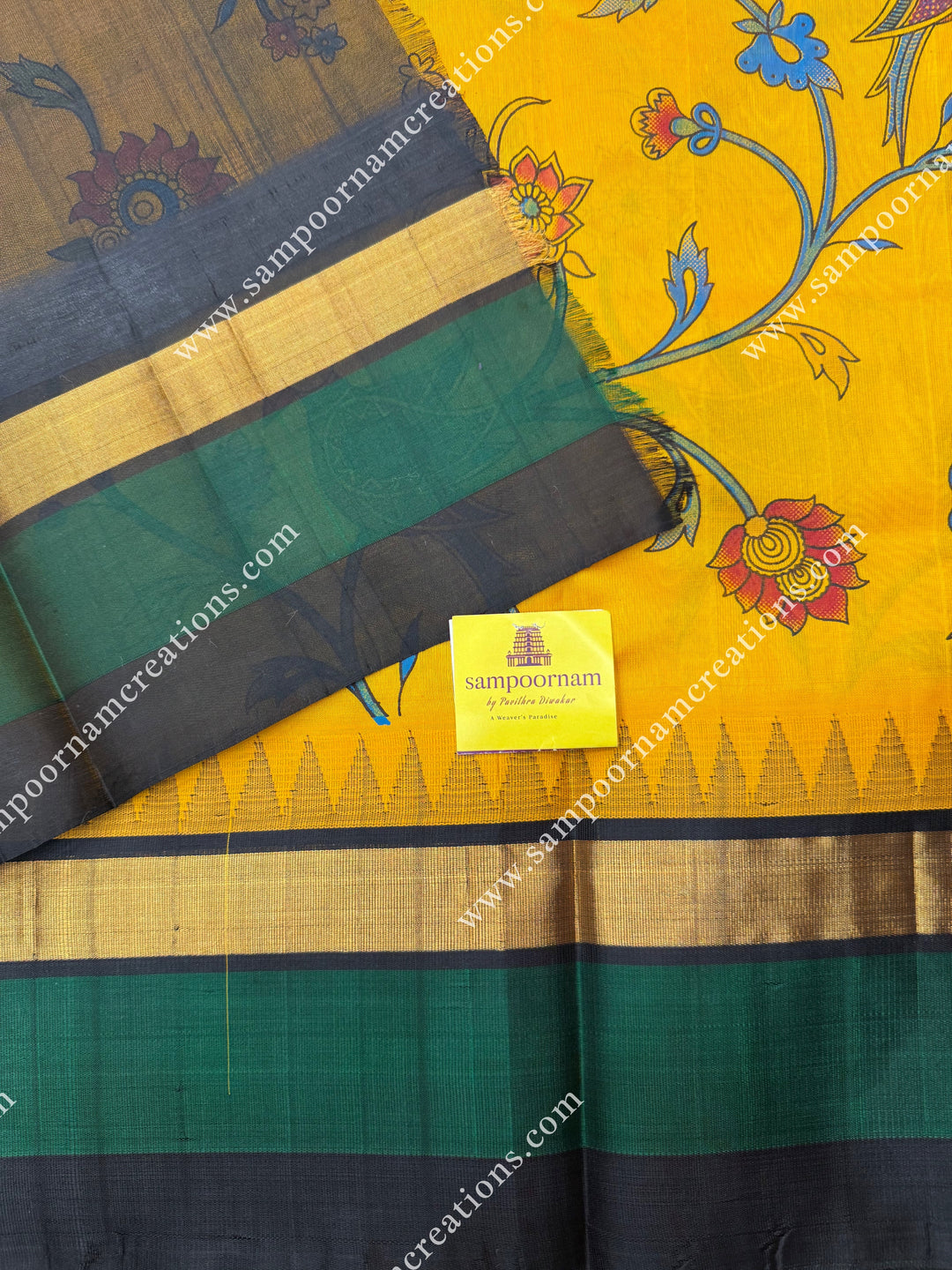 Manjal with Black , Floral Madhubani  Prints all over the body , Triple borders with Temple design and rich Pallu Korvai Silk Cotton Saree