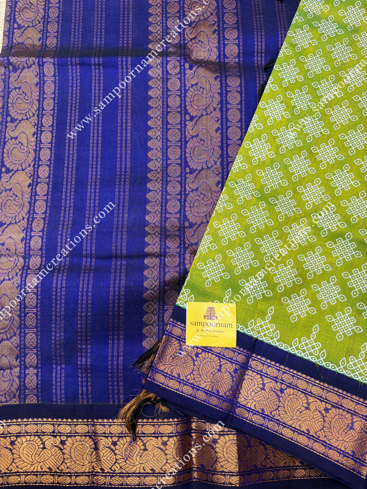 Parrot Green with Dark Blue , Kolam Prints all over the body , traditional borders and rich Pallu Korvai Silk Cotton Saree