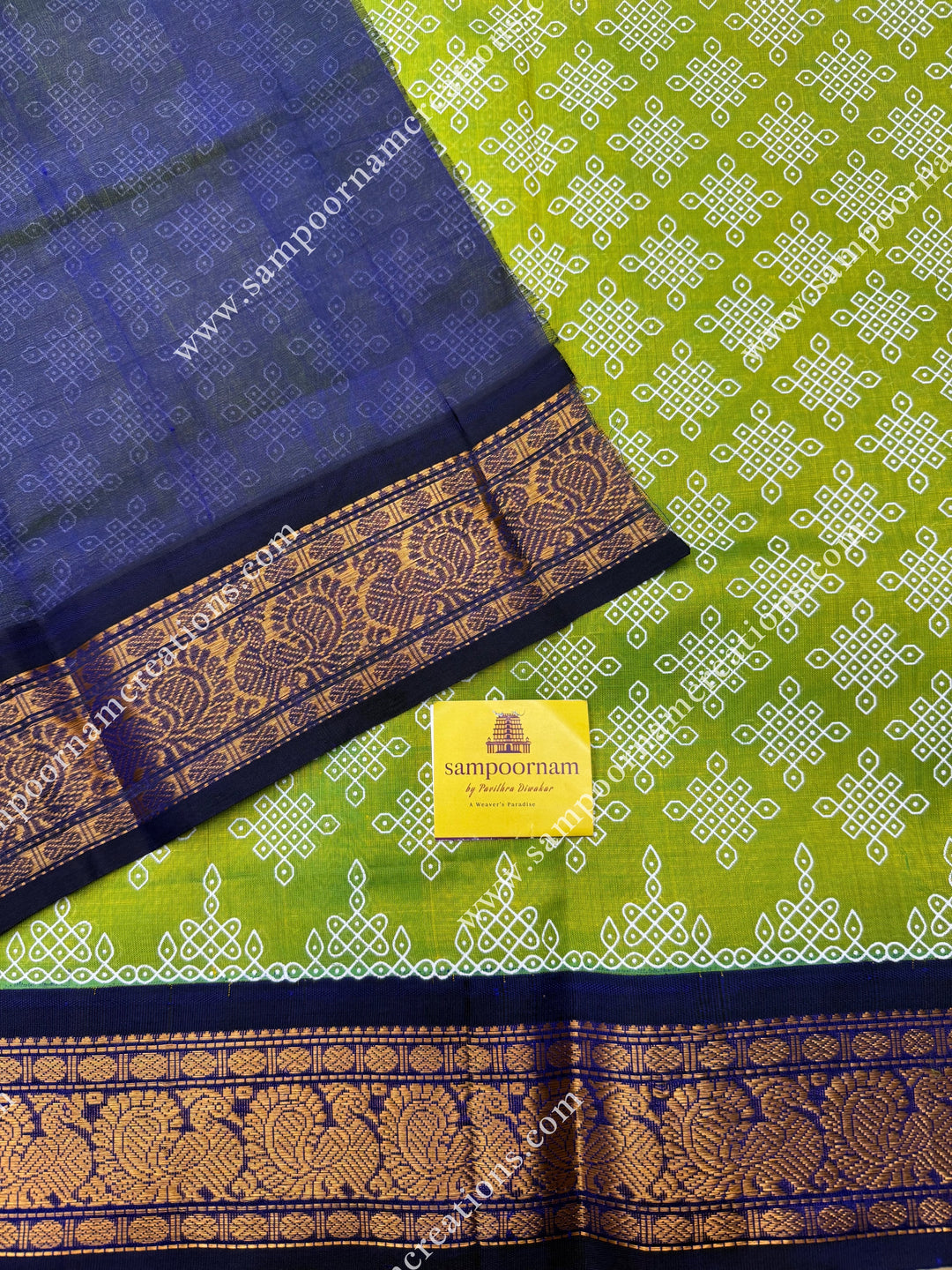 Parrot Green with Dark Blue , Kolam Prints all over the body , traditional borders and rich Pallu Korvai Silk Cotton Saree