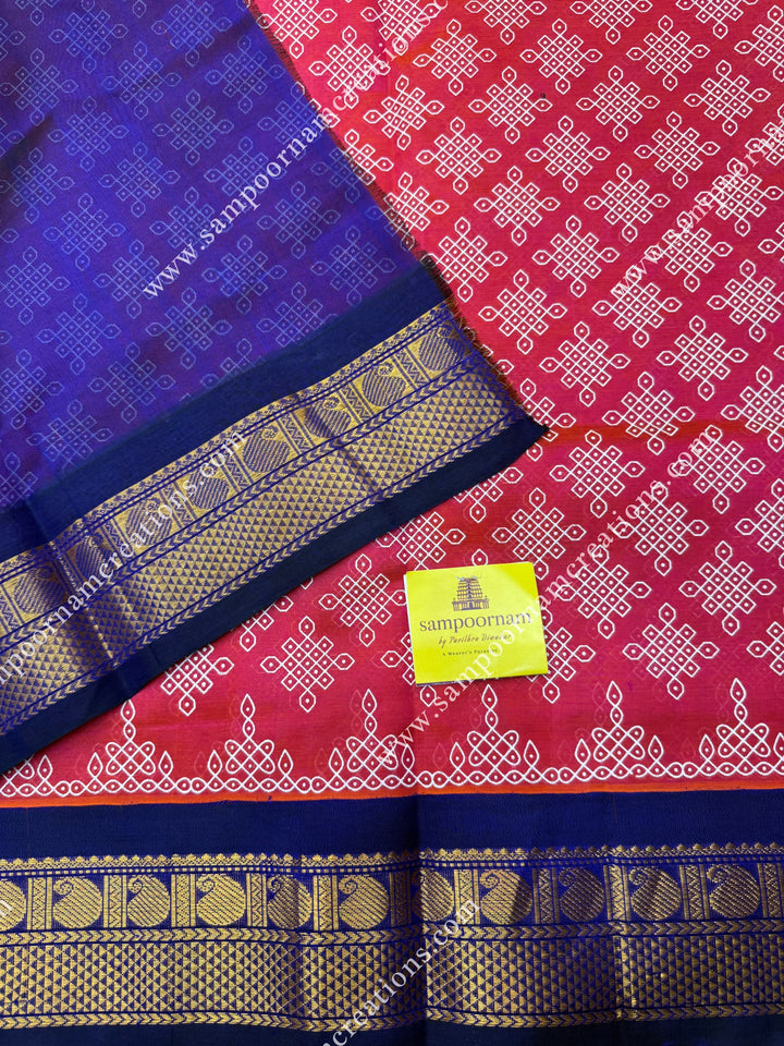 Orangish Pink with Dark Blue , Kolam Prints all over the body , traditional borders and rich Pallu Korvai Silk Cotton Saree