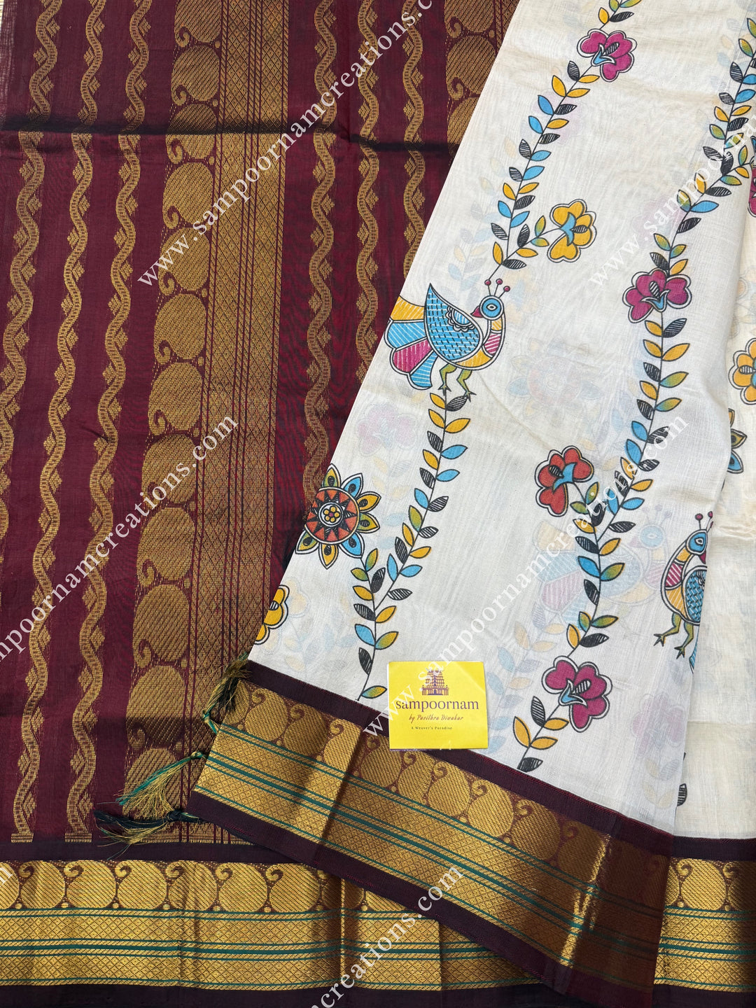 Off White with Wine, Floral Madhubani  Prints all over the body , traditional borders and rich Pallu Korvai Silk Cotton Saree