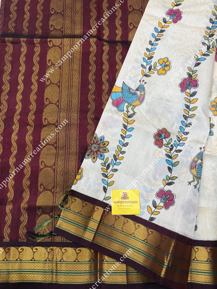 Off White with Wine, Floral Madhubani  Prints all over the body , traditional borders and rich Pallu Korvai Silk Cotton Saree