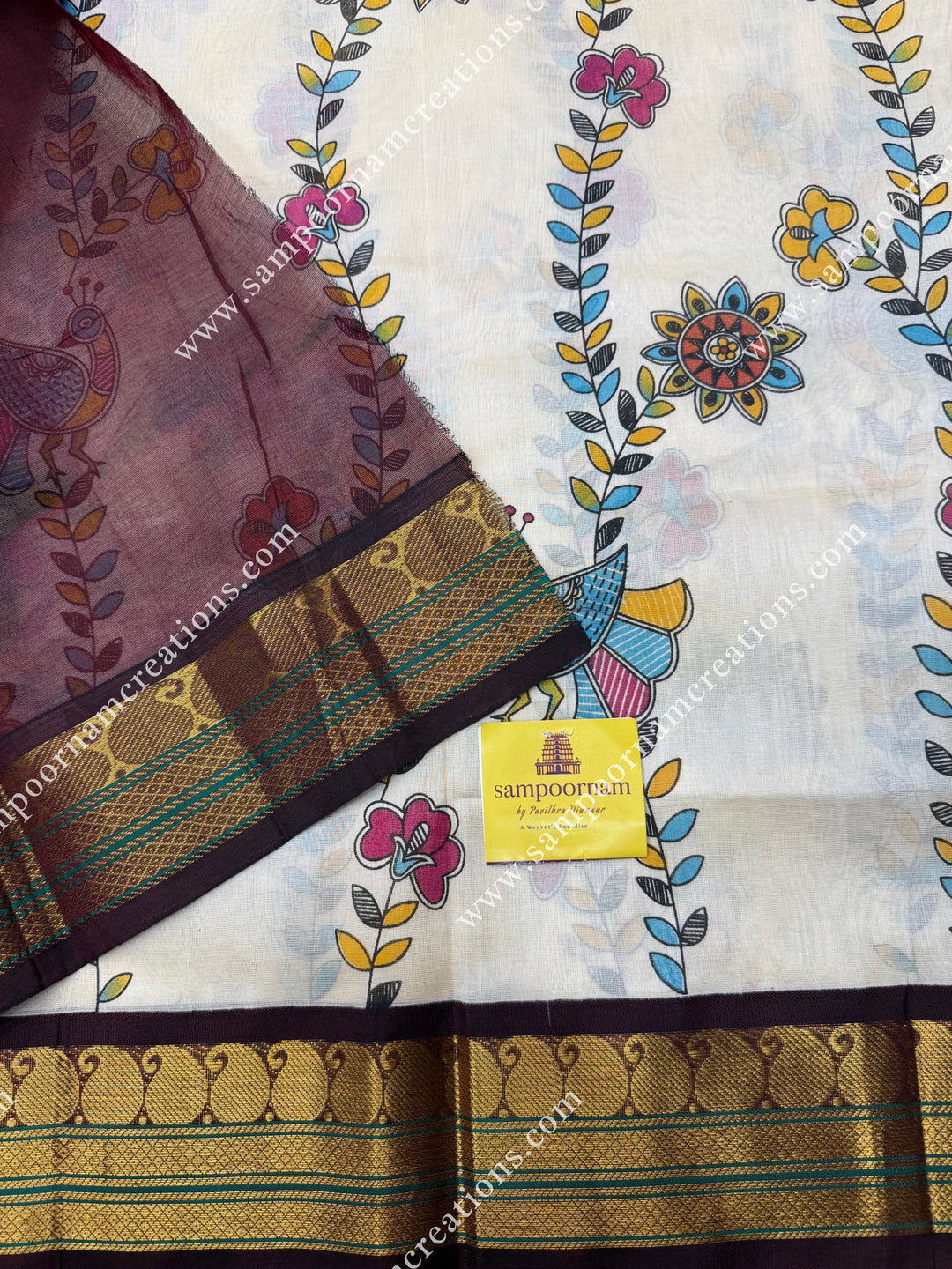 Off White with Wine, Floral Madhubani  Prints all over the body , traditional borders and rich Pallu Korvai Silk Cotton Saree