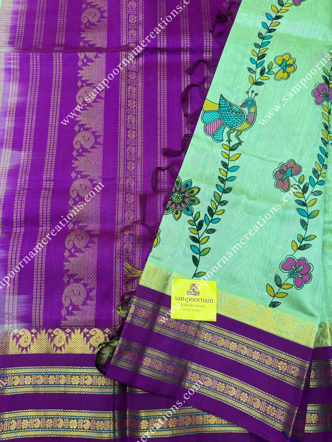 Pastel Green  with Megenta, Floral Madhubani  Prints all over the body , rettapet borders with temple design and rich Pallu Korvai Silk Cotton Saree
