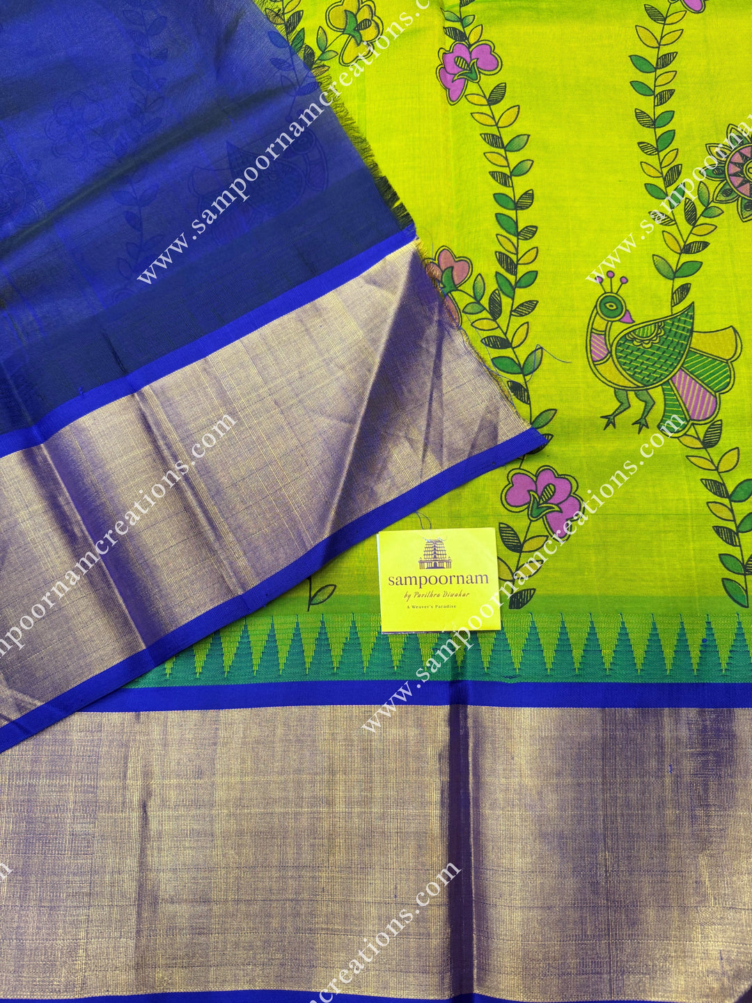 Sneha Green with Blue , Floral Madhubani  Prints all over the body , Tissue borders with Temple design and rich Pallu Korvai Silk Cotton Saree