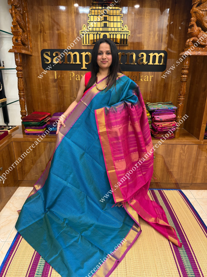 Turquoise Blue with Magenta , Rich Zari Checks in the body , traditional borders and rich Pallu Silk Cotton Sarees