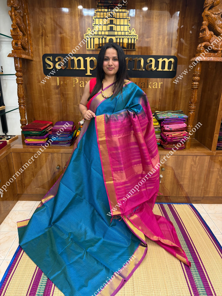 Turquoise Blue with Magenta , Rich Zari Checks in the body , traditional borders and rich Pallu Silk Cotton Sarees