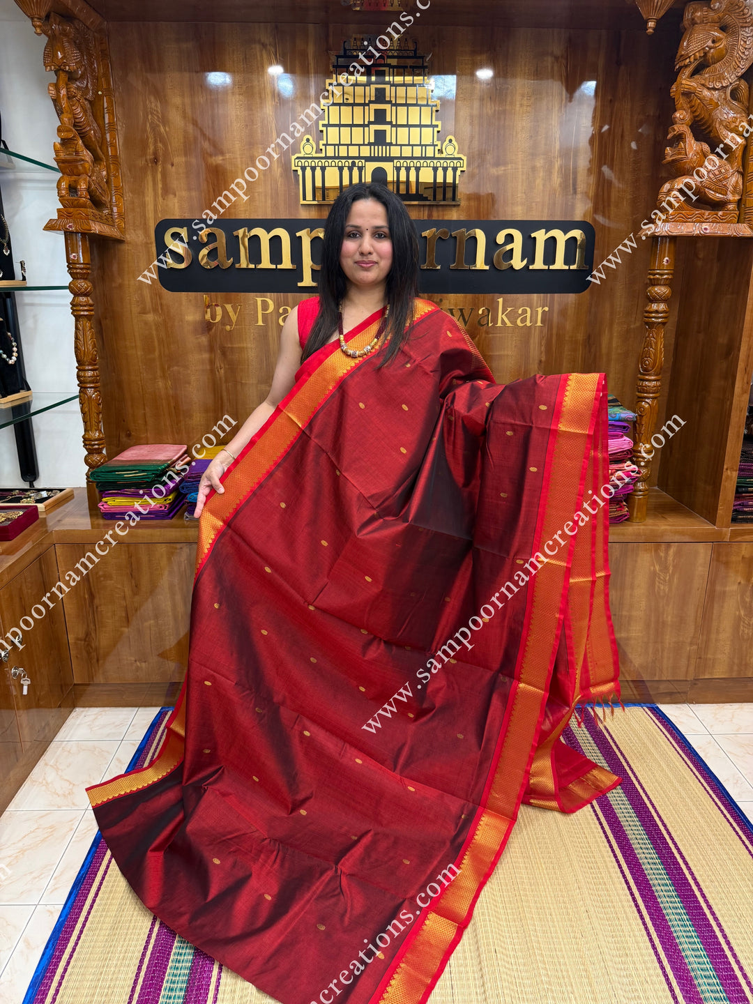 Marron with Red  , Rich Zari Butta in the body , traditional borders and rich Pallu Silk Cotton Saree