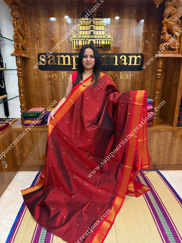 Marron with Red  , Rich Zari Butta in the body , traditional borders and rich Pallu Silk Cotton Saree