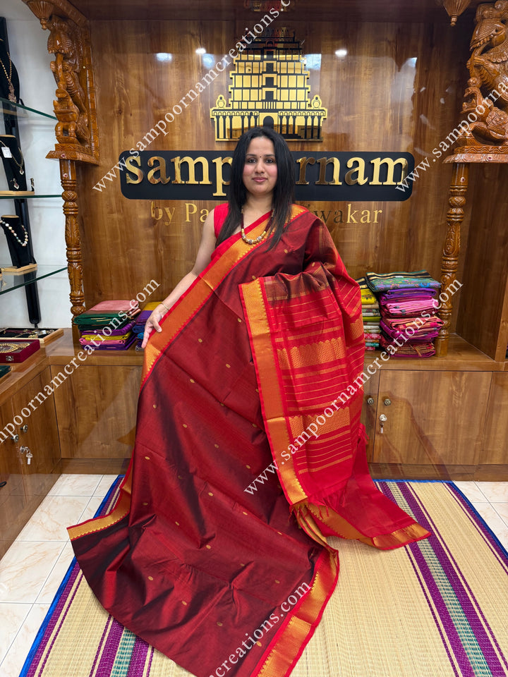 Marron with Red  , Rich Zari Butta in the body , traditional borders and rich Pallu Silk Cotton Saree