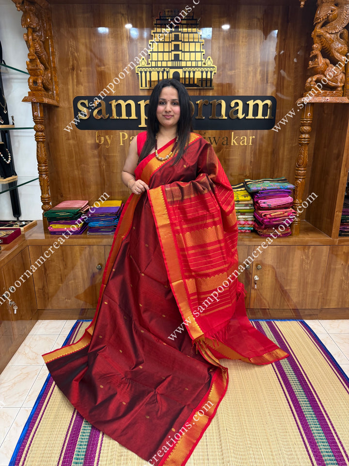 Marron with Red  , Rich Zari Butta in the body , traditional borders and rich Pallu Silk Cotton Saree