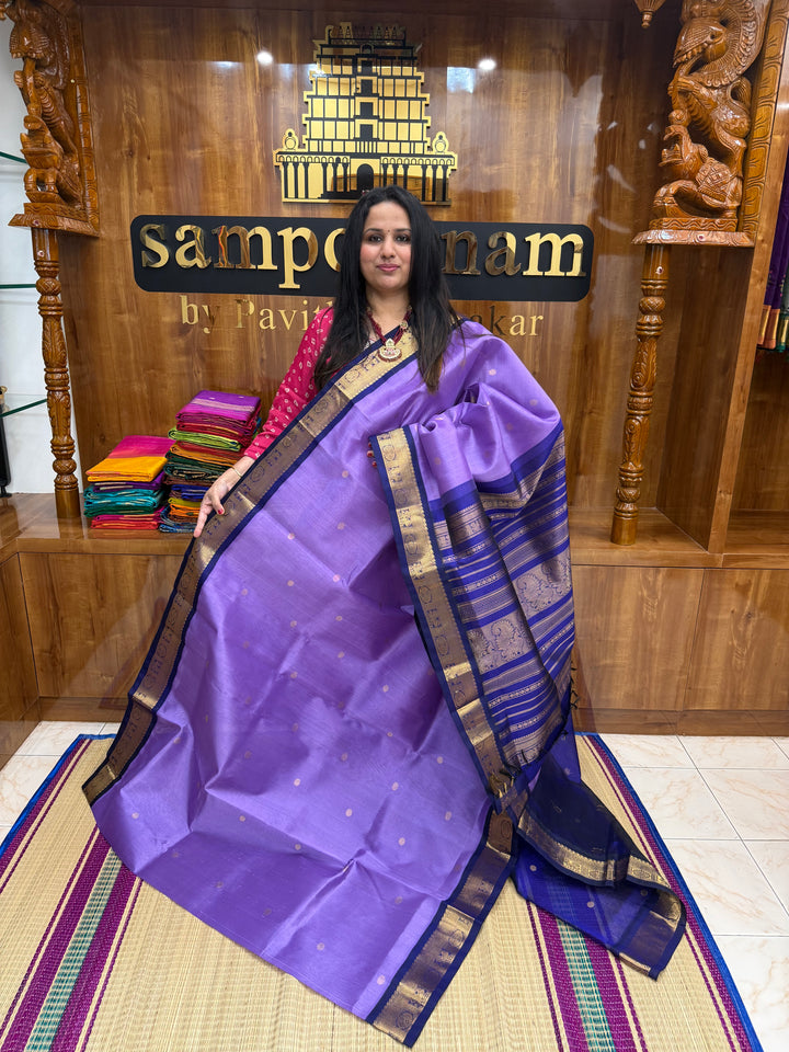 Lavender with Dark Blue , rich  Zari Butta in the body , traditional borders and rich Pallu Korvai Silk Cotton Saree