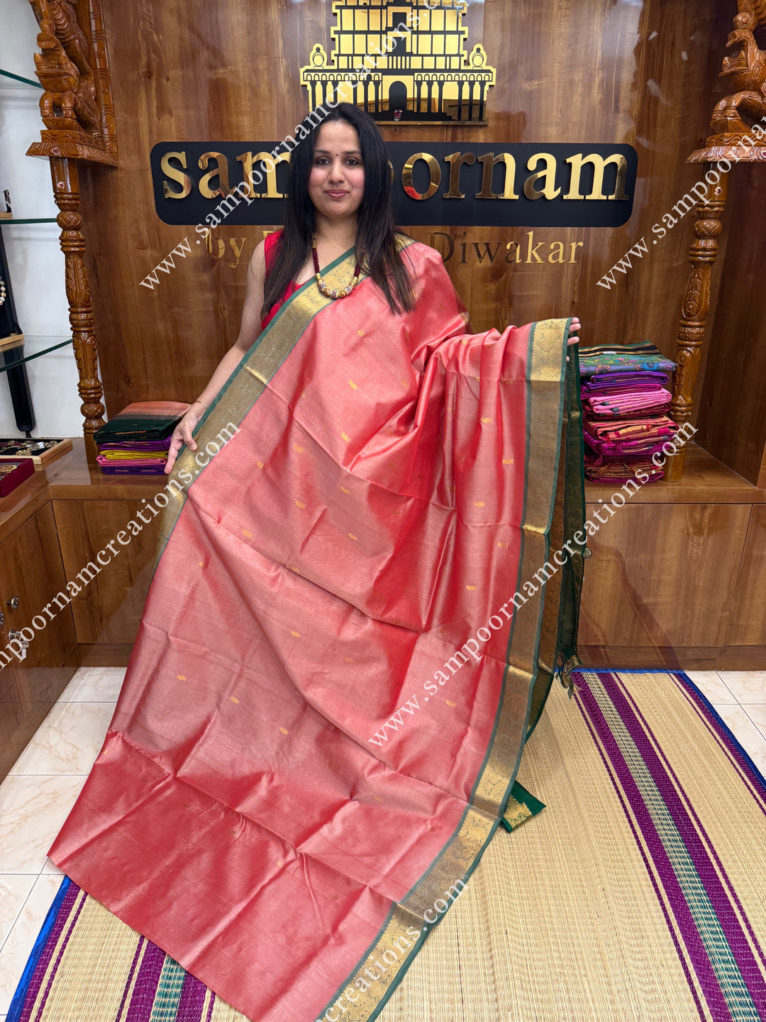 Peach with Green  , Rich Zari Butta in the body , traditional borders and rich Pallu Silk Cotton Saree