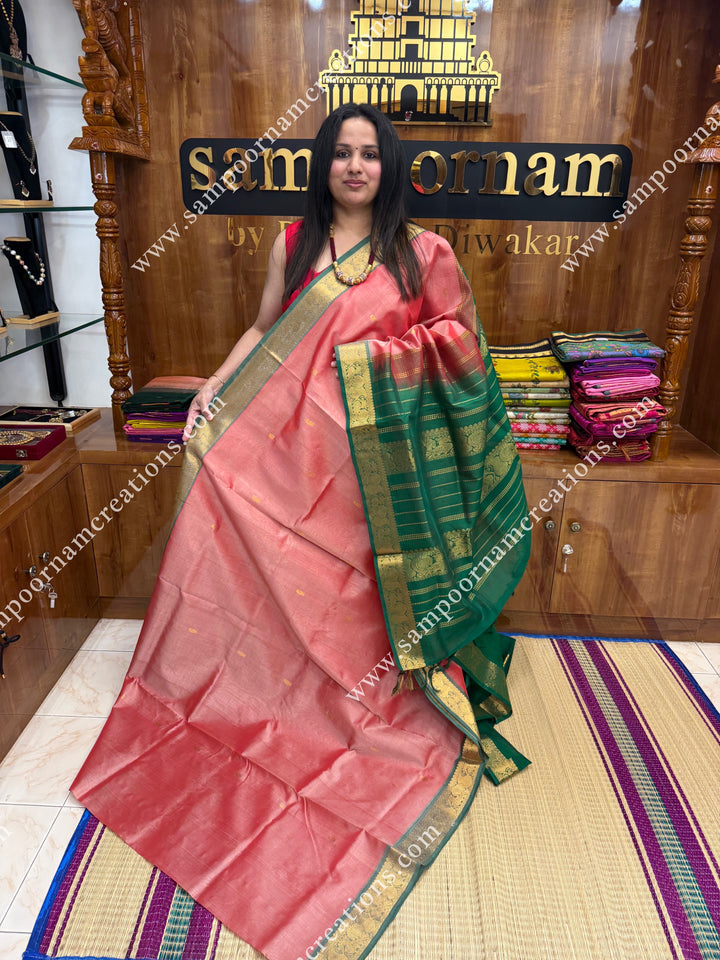 Peach with Green  , Rich Zari Butta in the body , traditional borders and rich Pallu Silk Cotton Saree