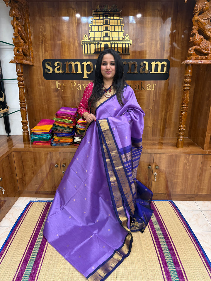 Lavender with Dark Blue , rich  Zari Butta in the body , traditional borders and rich Pallu Korvai Silk Cotton Saree