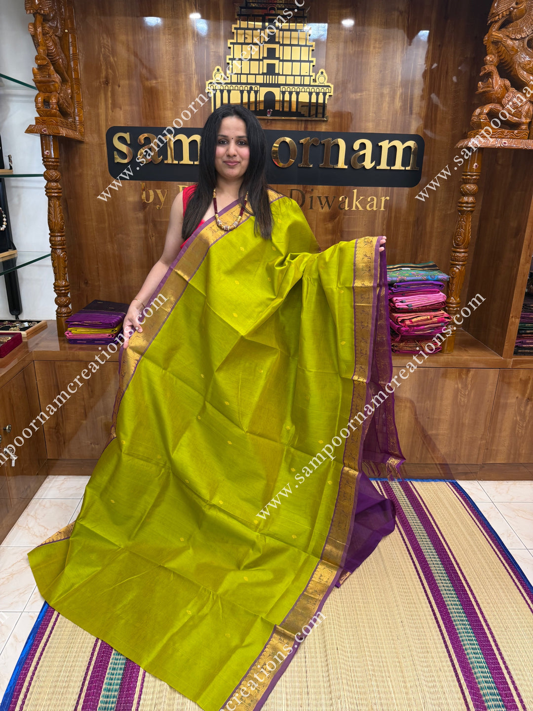 Lemon Yellow with Dark Magenta  , Rich Zari Butta in the body , traditional borders and rich Pallu Silk Cotton Saree