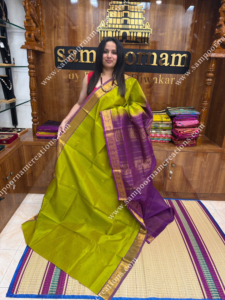 Lemon Yellow with Dark Magenta  , Rich Zari Butta in the body , traditional borders and rich Pallu Silk Cotton Saree