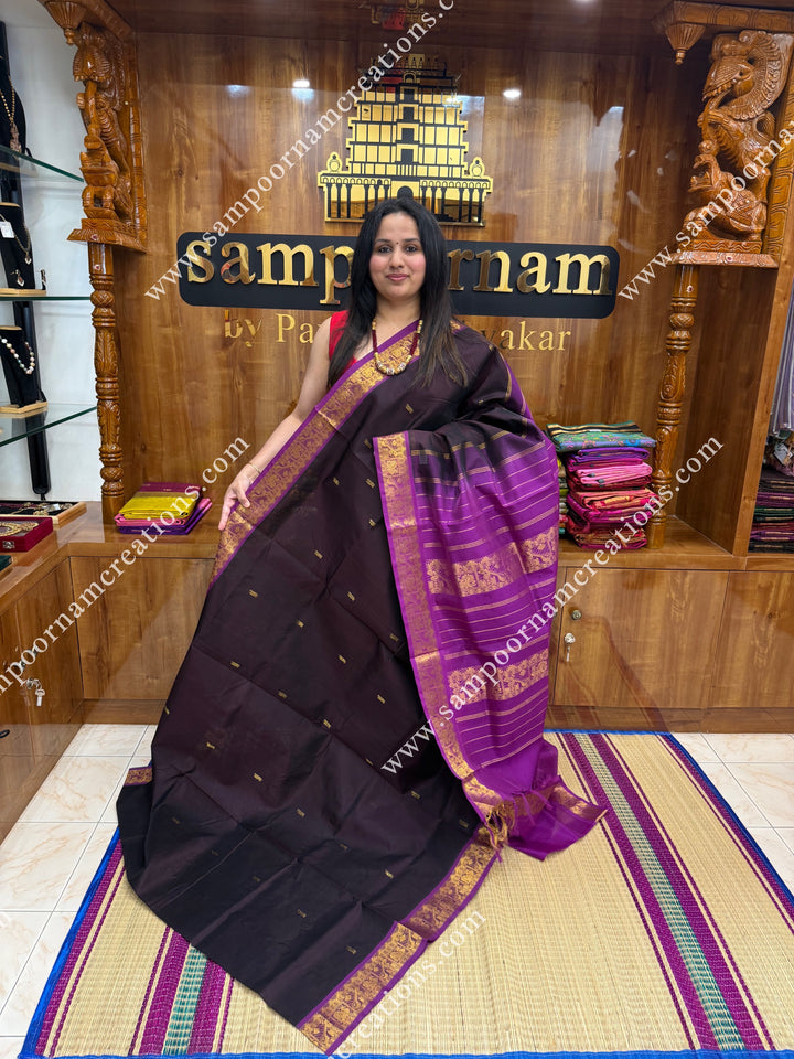 Dark Brown with Magenta , Rich Annam Zari Butta in the body , traditional borders and rich Pallu Silk Cotton Saree