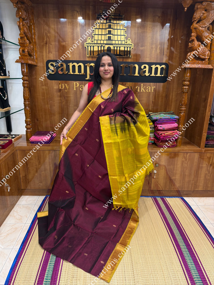 Arakku with Lemon Yellow  , Green Selvedge , Rich Floral Zari Buttta in the body , traditional borders and rich Pallu Silk Cotton Saree