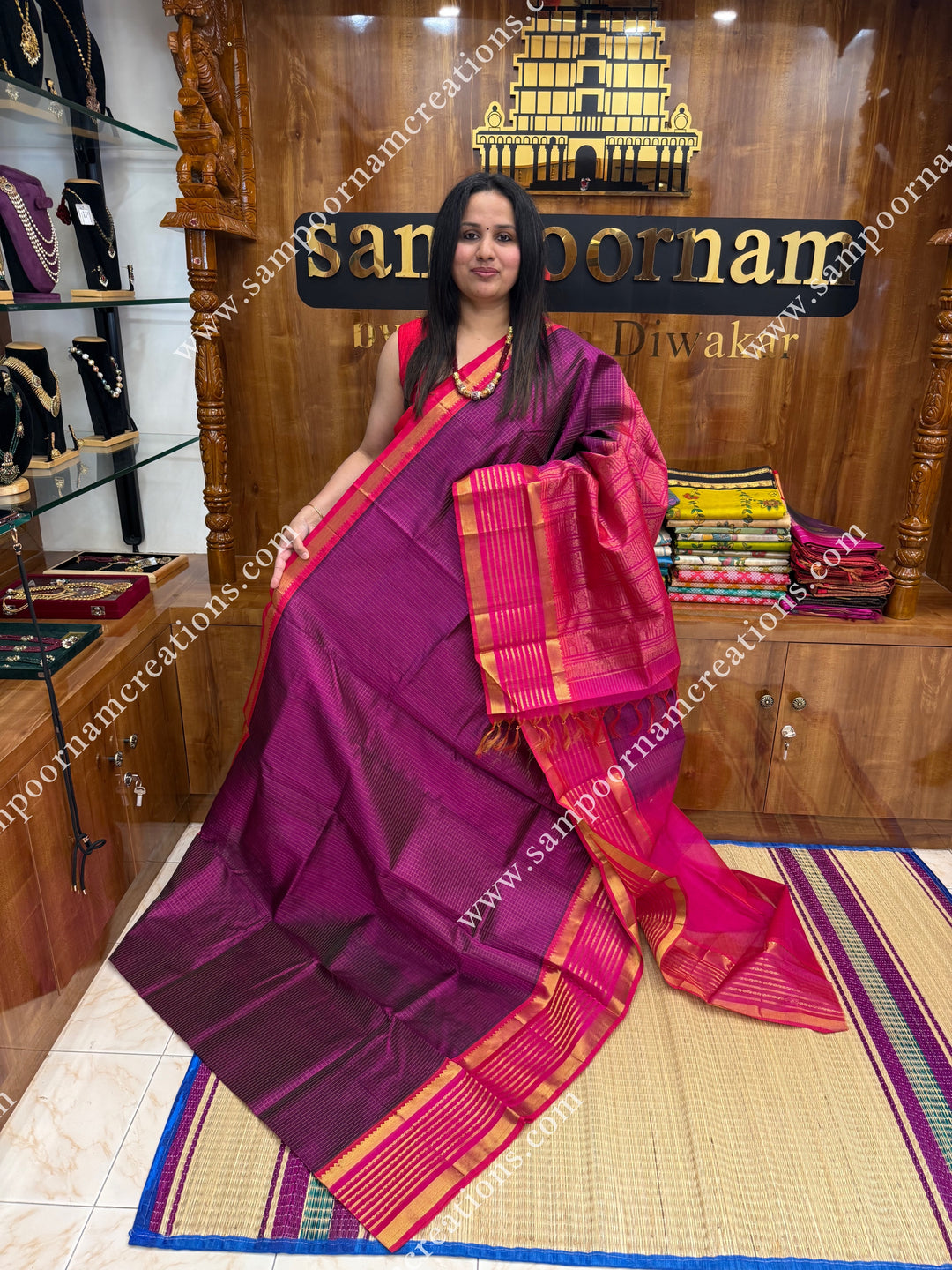 Dark plum with Pink , Rich Zari Checks in the body ,one side Long borders rich Pallu Silk Cotton Sarees