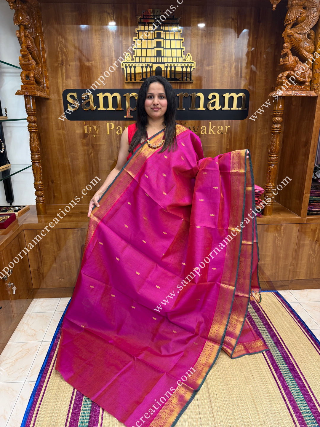 Rani Pink , Green Selvedge , Vairaoosi Zari lines and Mango Zari Butta in the body , traditional borders and rich Pallu Silk Cotton Sarees