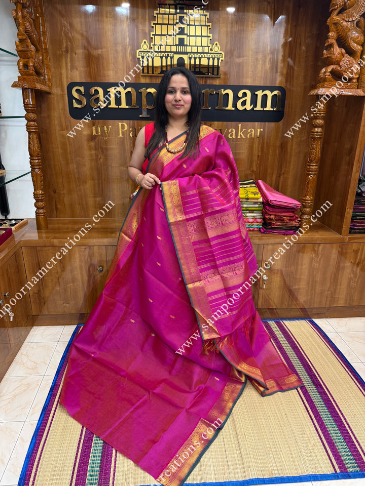 Rani Pink , Green Selvedge , Vairaoosi Zari lines and Mango Zari Butta in the body , traditional borders and rich Pallu Silk Cotton Sarees